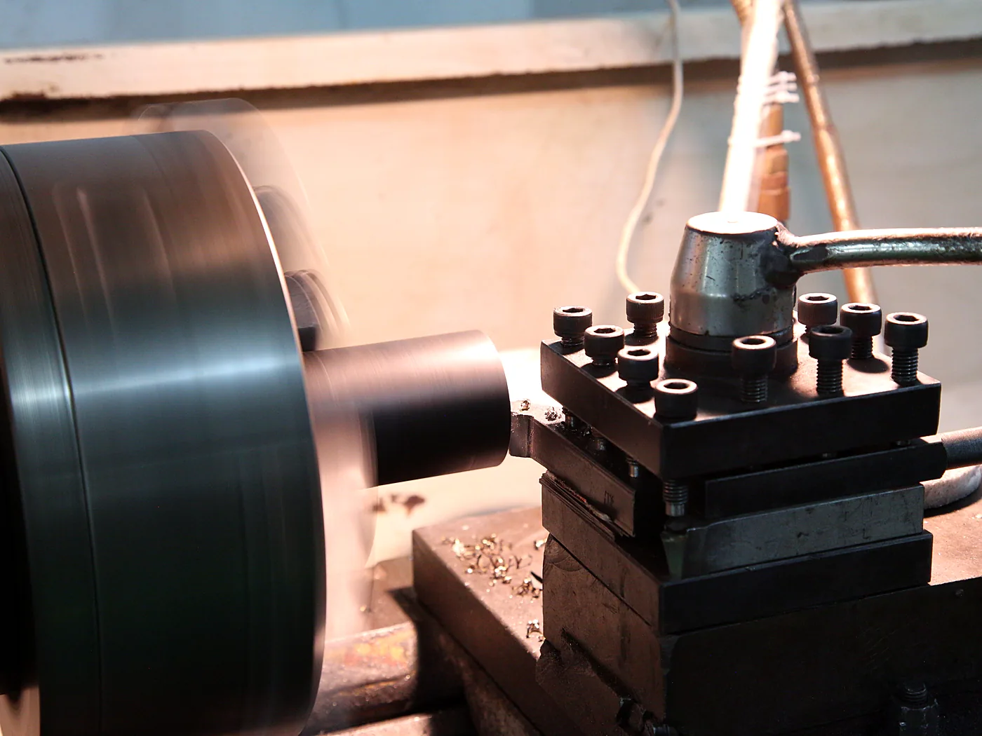 Milling machine cutting a metal part