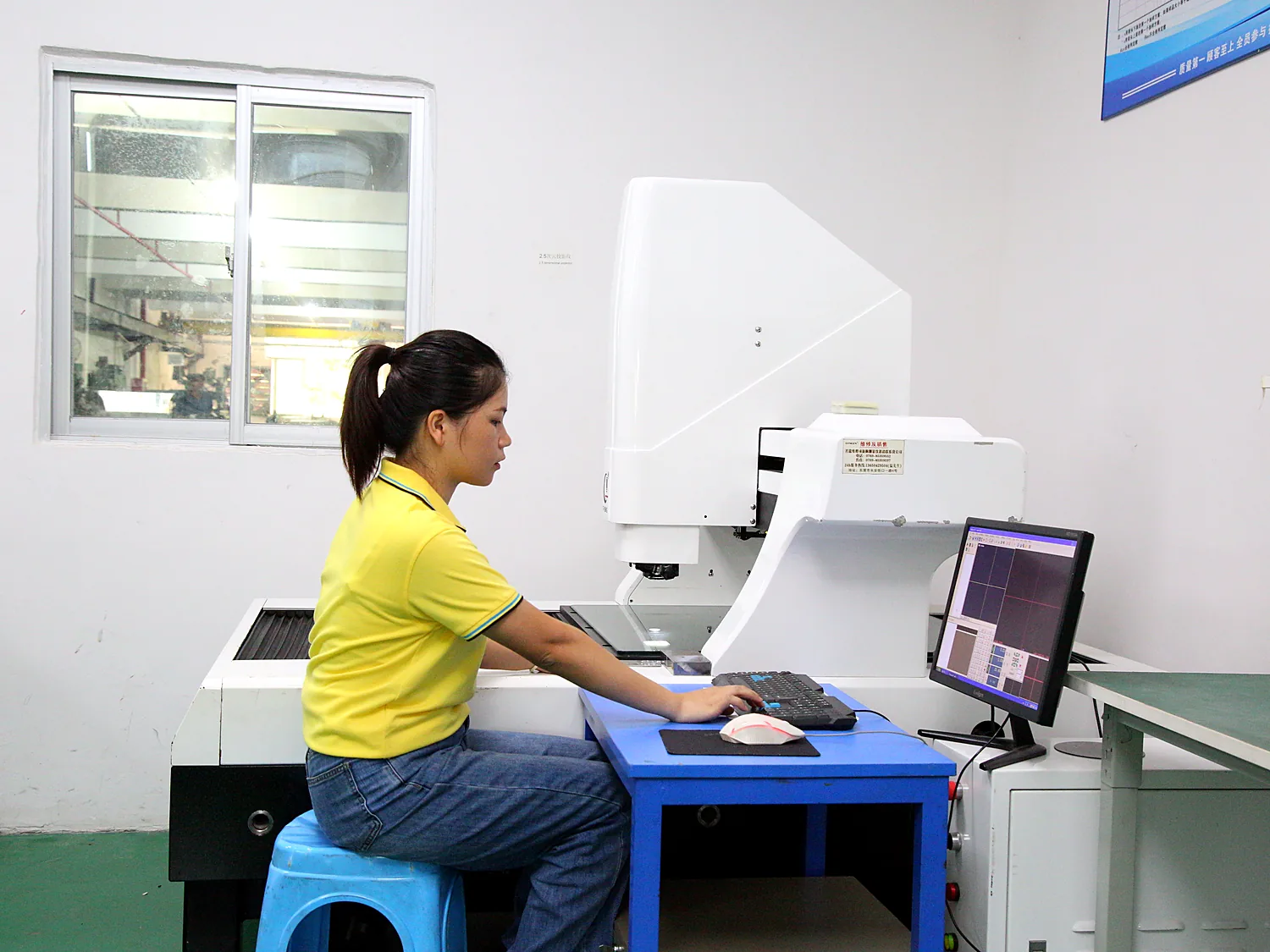 Technician operating a coordinate measuring machine