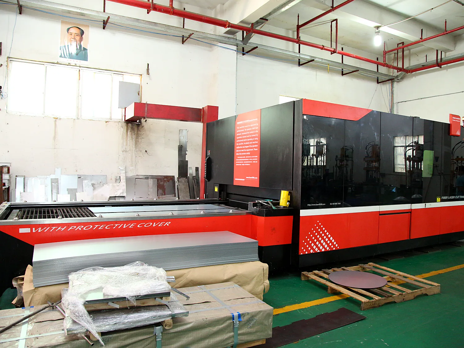 Large red mechanical press close up