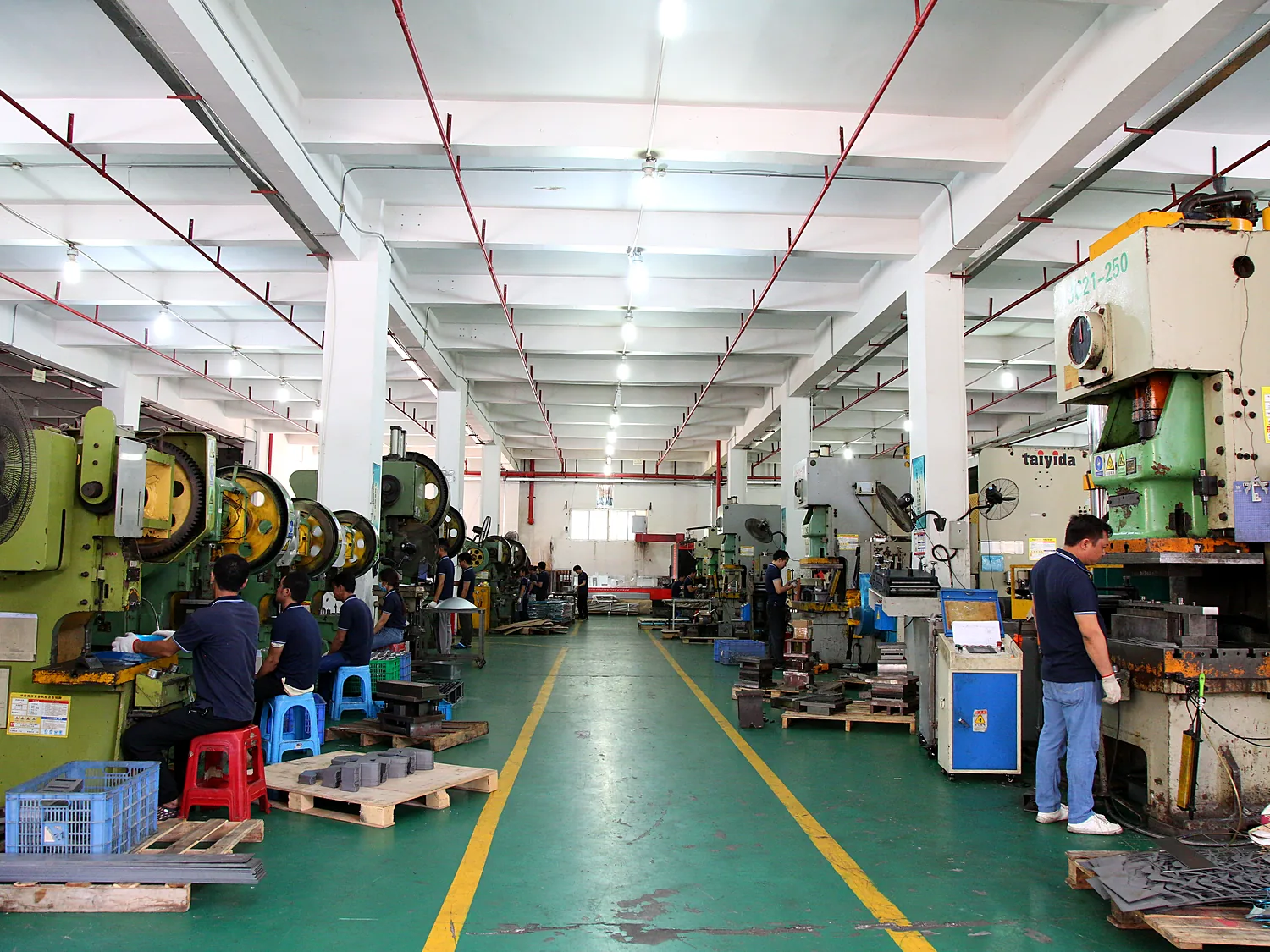 Operator monitoring a robotic welding station