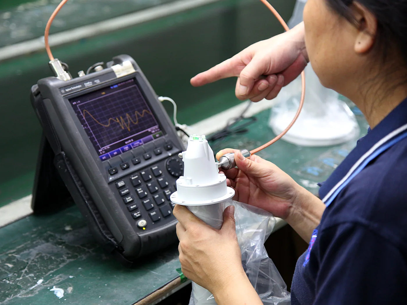 Handheld measuring instrument showing a reading